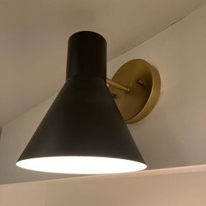 Black and gold light sconce